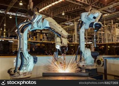 Robot welding assembly automotive part in factory