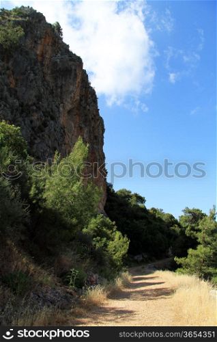 Rock and dirt road on the Mediterranean cost near Karaoz, Turkey