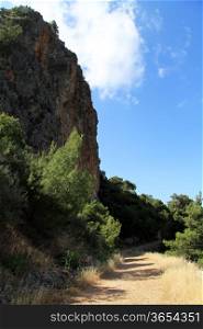 Rock and dirt road on the Mediterranean cost near Karaoz, Turkey