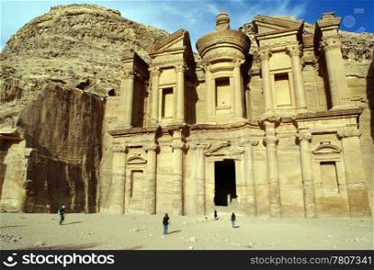 Rock and facade of monastery in Petra, Jordan