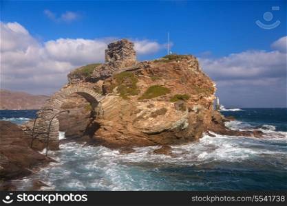 Rock and lighthouse at the stormy sea on greek island Andros&#xA;