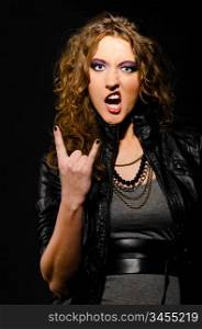 rock and roll woman is showing sign of the horns