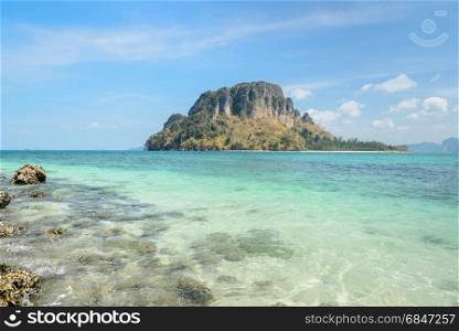 Rock beach with crystal clear andaman sea at Ko Daam Kwan Island in Krabi province, Thailand