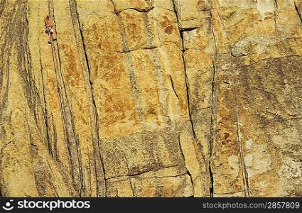 Rock climber on cliff face