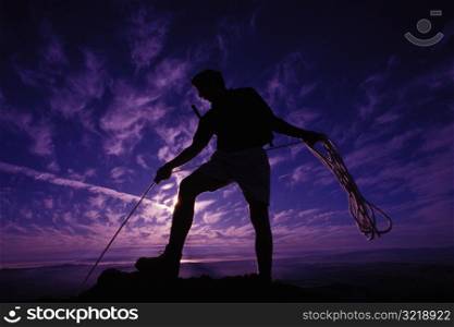 Rock Climber Outlined Against an Evening Sky