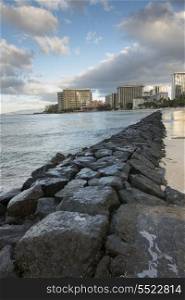 Rock formation along beachfront, Waikiki, Honolulu, Oahu, Hawaii, USA