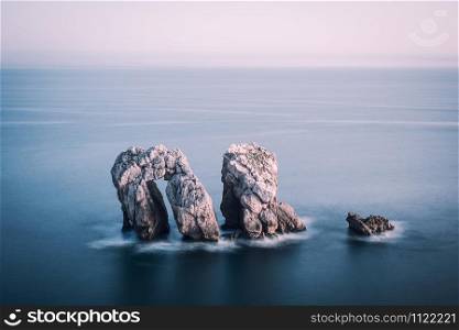 Rock formation at the ocean. Playa de la Arnia, Cantabria, Spain