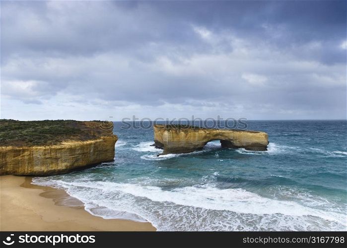 Rock formation in arch shape as seen from Great Ocean Road in Australia.