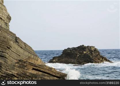 Rock formations in the sea, Italian Riviera, Mar Ligure, Genoa, Liguria, Italy