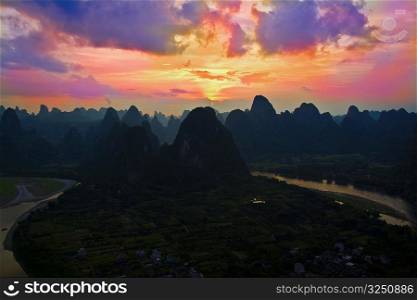 Rock formations on a landscape, Li River, XingPing, Yangshuo, Guangxi Province, China