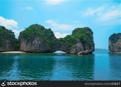 Rock islands in Halong Bay, Vietnam, Southeast Asia. UNESCO World Heritage Site. Scenic landscape with limestone mountains and sea at Ha Long Bay. Most popular landmark, tourist destination of Vietnam