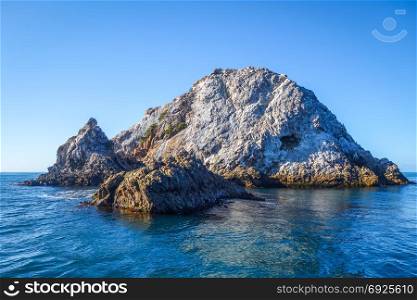 Rock islands in Kaikoura bay, New Zealand. Rocks in Kaikoura Bay