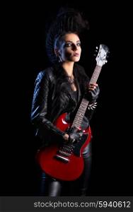 Rock musician in leather clothing isolated on black