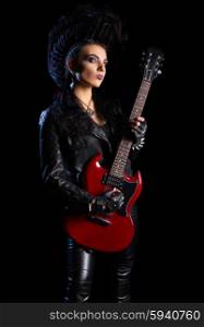 Rock musician in leather clothing isolated on black