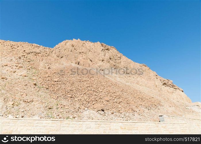 rock of masada in israel. rock and blue sky in israel near masada