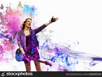 Rock passionate girl with black wings. Young attractive rock girl playing the electric guitar