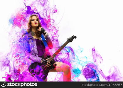 Rock passionate girl with black wings. Young attractive rock girl playing the electric guitar