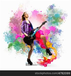 Rock passionate girl. Young attractive rock girl playing the electric guitar