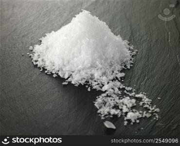 Rock salt on slate background