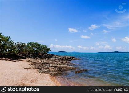 Rock sand beach on small island near Koh Lanta on hot summer day with clear sky. Krabi - Thailand