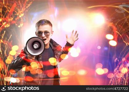 Rock star. Image of young man musician singing in megaphone