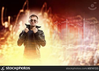 Rock star. Image of young man rock musician in lights