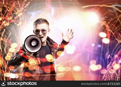 Rock star. Image of young man rock musician screaming in megaphone