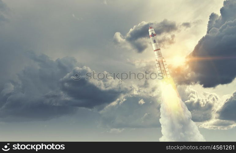 Rocket Space Ship. Military missile flying high in blue sky