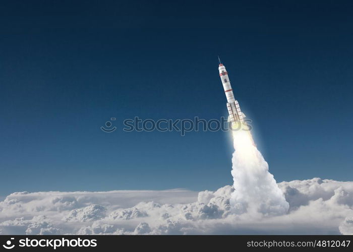 Rocket Space Ship. Military missile flying high in blue sky