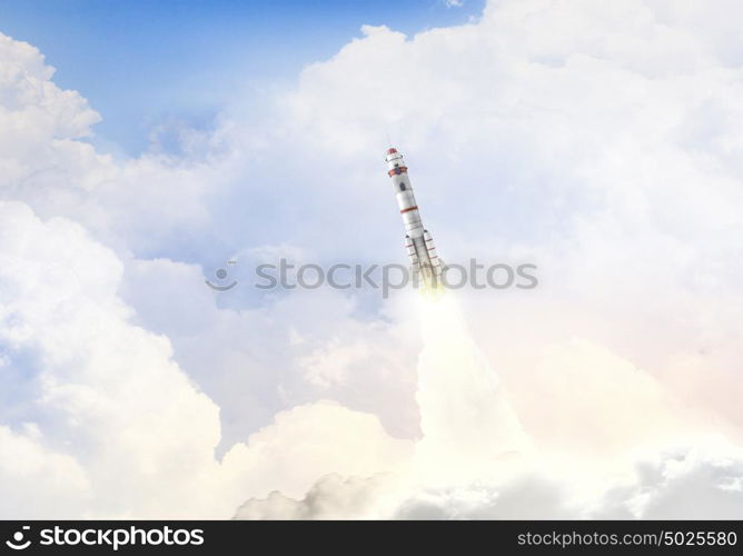 Rocket Space Ship. Military missile flying high in blue sky