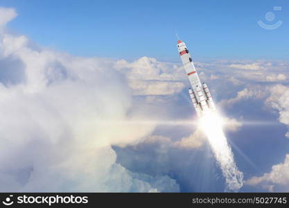 Rocket Space Ship. Military missile flying high in blue sky