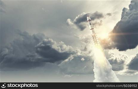 Rocket Space Ship. Military missile flying high in blue sky