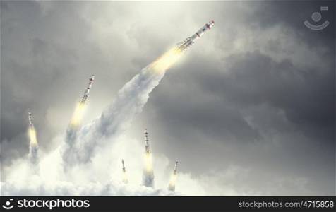 Rocket Space Ship. Military missiles flying high in blue sky