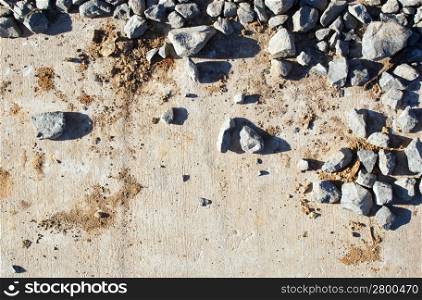 Rocks and mud over concrete on a building construction site
