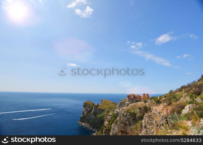 Rocks and sea under blue sky