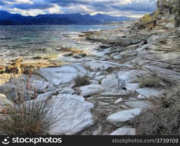 Rocks and shoreline in the Desert des Agriates near St Florent in CorsicaRocks and shoreline in the Desert des Agriates near St Florent in Corsica