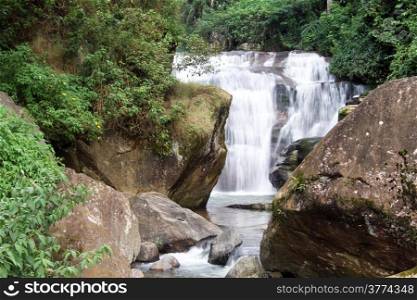 Rocks and small Ramboda waterfall in Sri Lanka