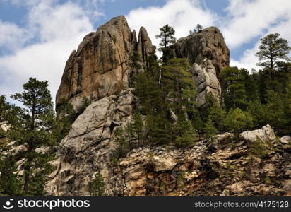 rocks and trees against a blue sky