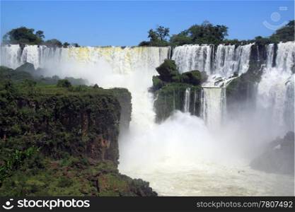 Rocks and wide Iguazu waterfall in Argentina