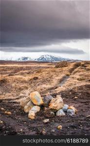 Rocks in a highland landscape with cloudy weather