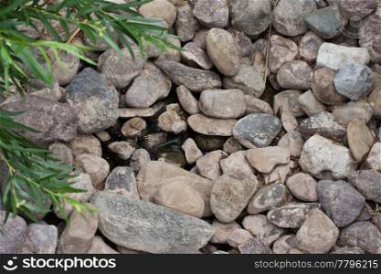 rocks in a pond as wallpaper or texture