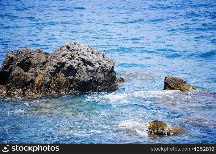 Rocks in the sea, Italian Riviera, Santa Margherita Ligure, Mar Ligure, Genoa, Liguria, Italy