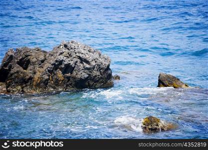 Rocks in the sea, Italian Riviera, Santa Margherita Ligure, Mar Ligure, Genoa, Liguria, Italy