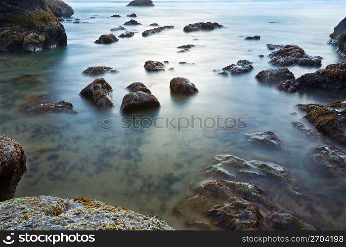 Rocks in tranquil ocean water