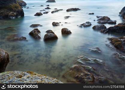 Rocks in tranquil ocean water