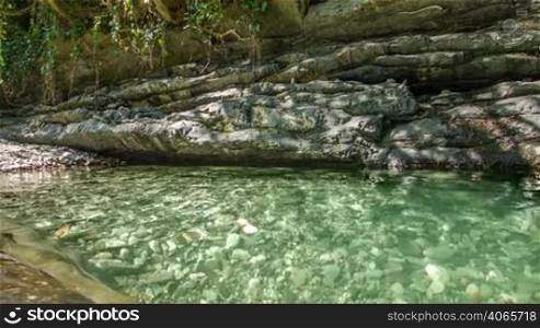 Rocks lake in forest with clear water 2