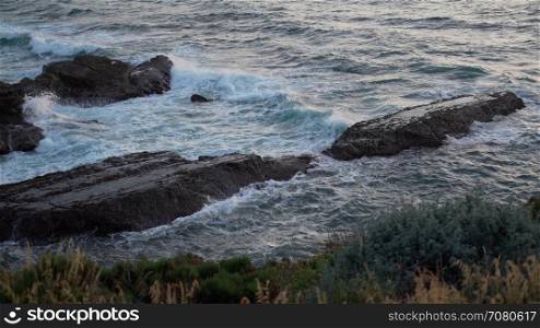 Rocks off the coast at sunset near Spoonera??s Cove
