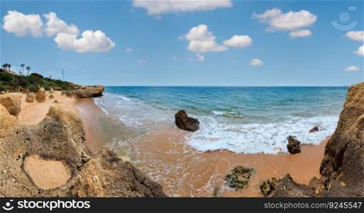 Rocks on∑mer sandy Albufeira beach  Algarve, Portugal . Panorama