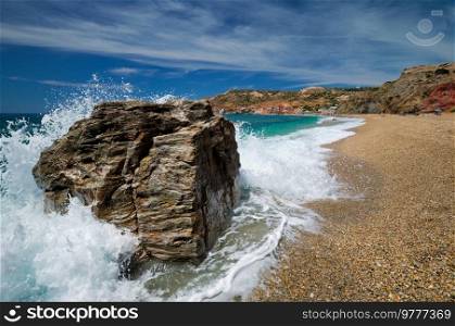 Rocks on Paleochori beach and waves of Aegean sea, Milos island, Cyclades, Greece. Slow motion. Paleochori beach, Milos island, Cyclades, Greece