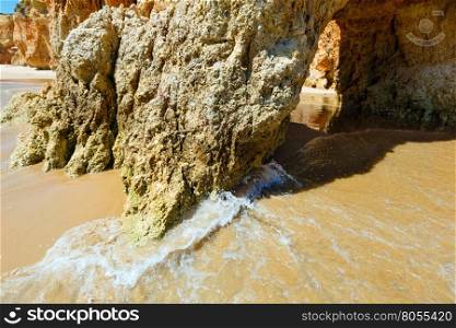 Rocks on sandy beach Dos Tres Irmaos(Portimao, Alvor, Algarve, Portugal).